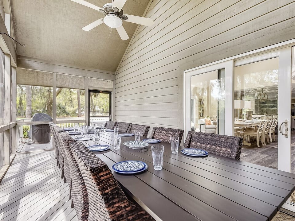 Screened Porch with Large Dining Table at 18 Woodbine Place