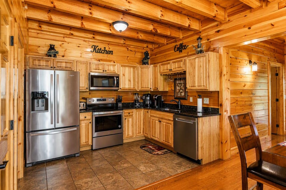Enjoy a full‑size stainless‑steel French‑door fridge with plenty of room for all your vacation groceries—a rare luxury in a two‑bedroom cabin