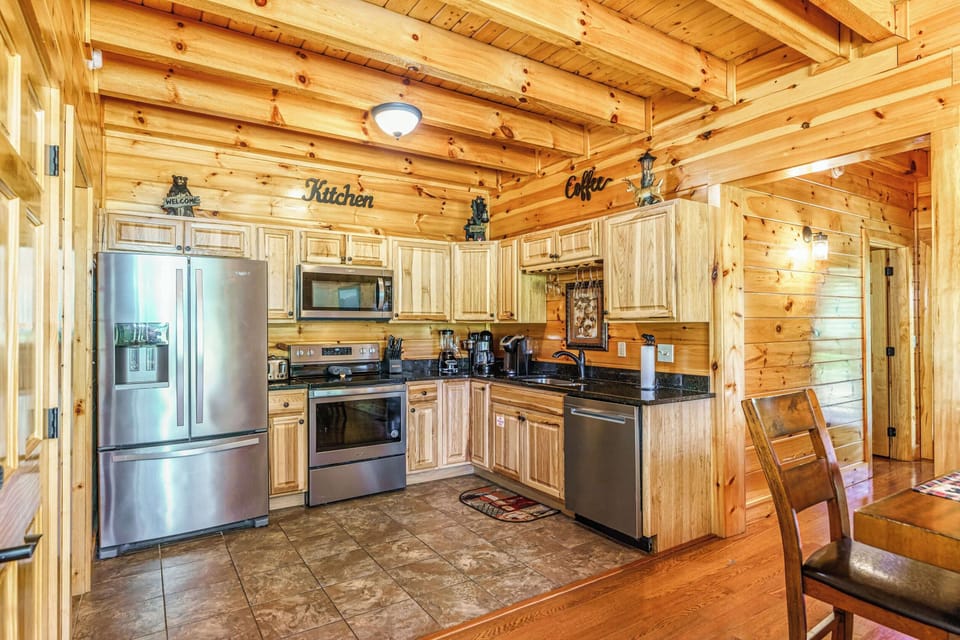 Enjoy a full‑size stainless‑steel French‑door fridge with plenty of room for all your vacation groceries—a rare luxury in a two‑bedroom cabin
