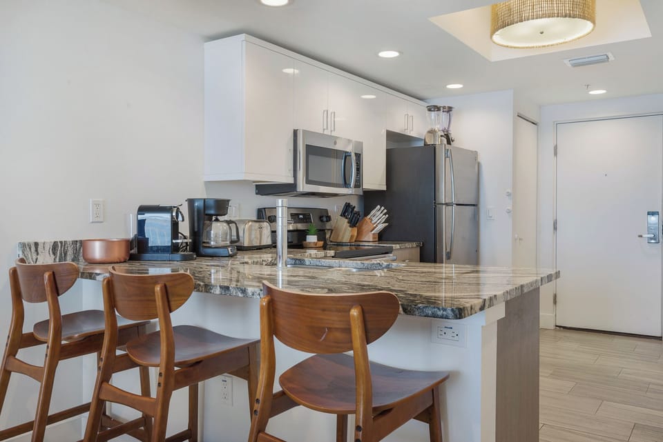 Wrap around bar counter top to assist with meal prep or your morning coffee.