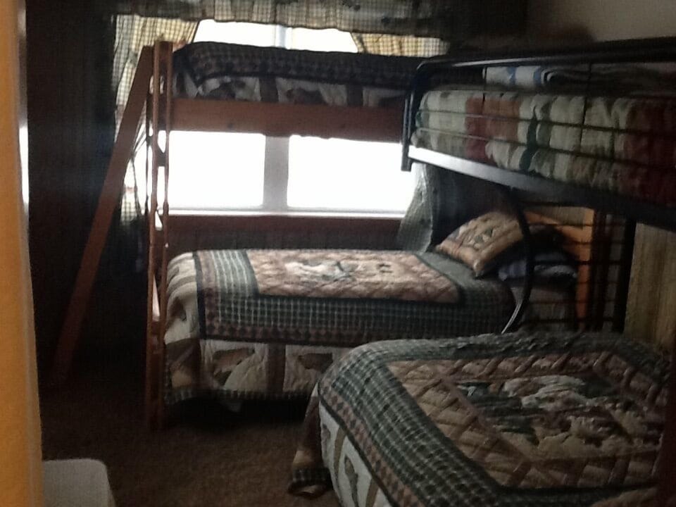 Bedroom 3-  twin bunk beds and a double bed with a twin on top