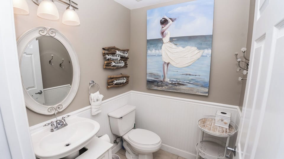 A Half Bath At Entrance