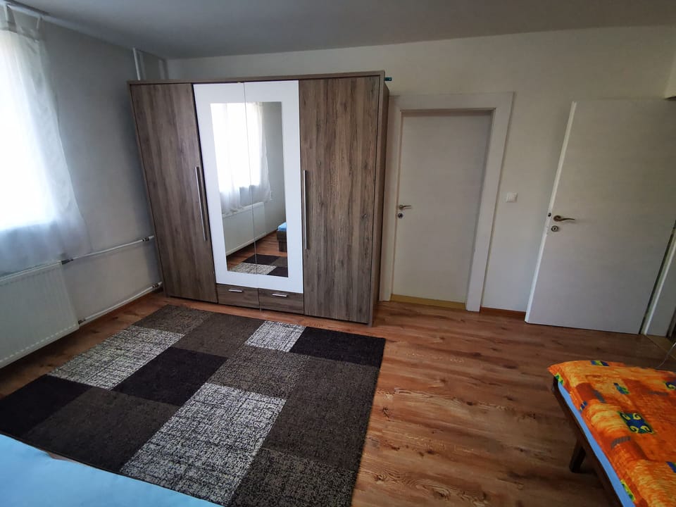 2 bedrooms, blackout drapes, soundproofing, iron/ironing board