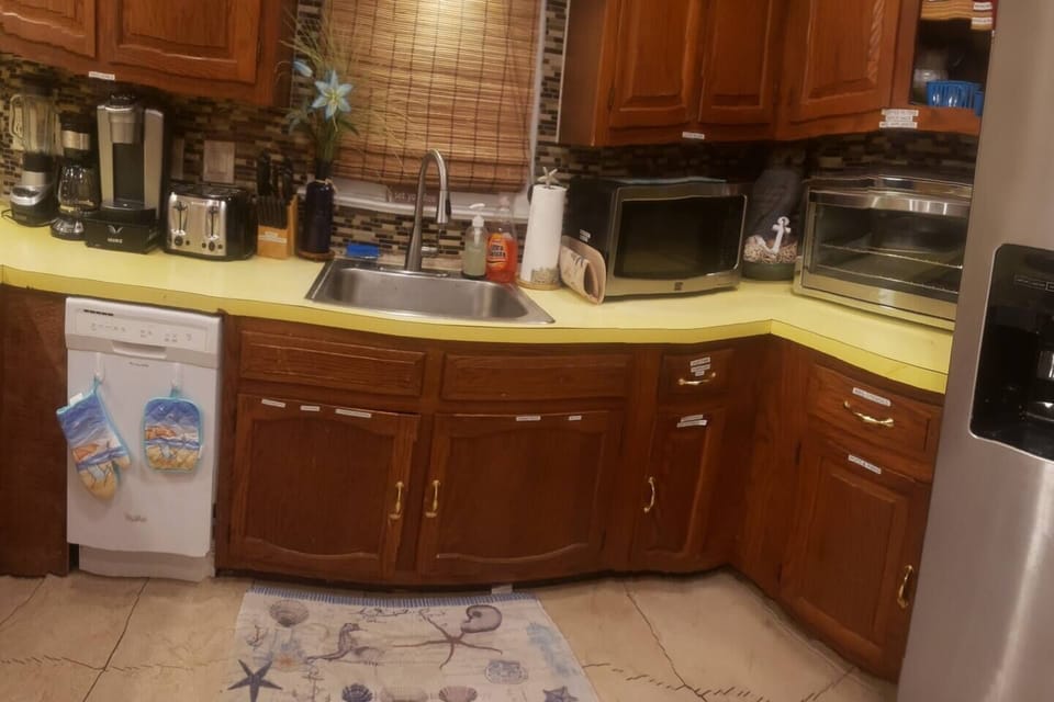 Fully furnished kitchen with dishwasher stove fridge and a plethora of other appliances to make your stay more at-home. Everything labeled for your convenience. 