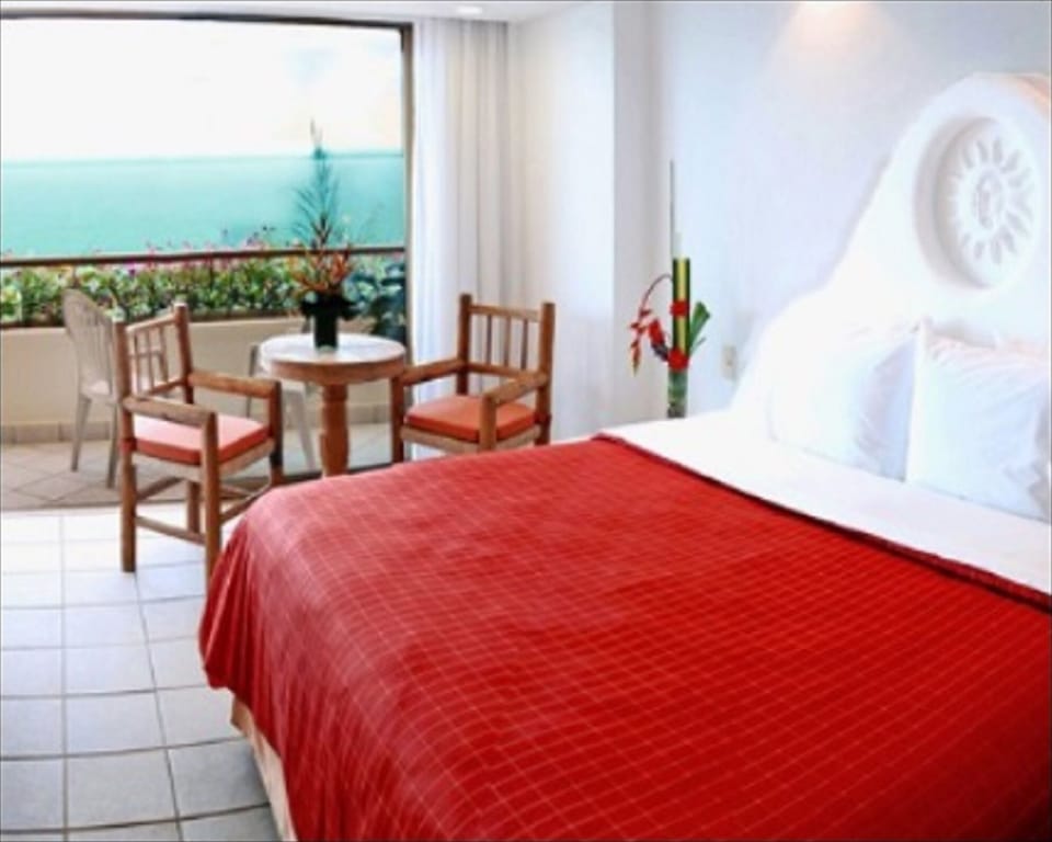 King size bed, deck, bathroom in 1st half of Presidential Suite.