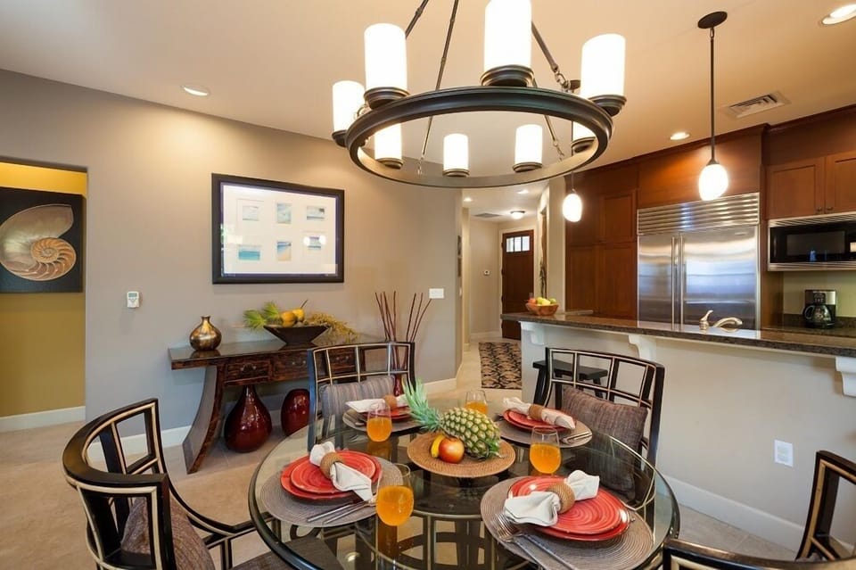 Dining room with glass top table and seating for four
