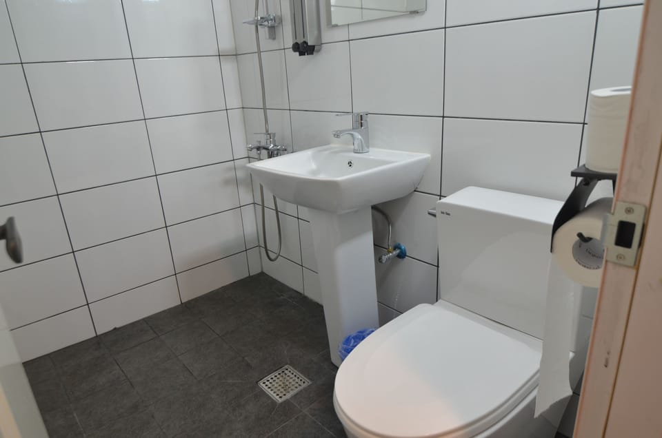 Shower, free toiletries, hair dryer, slippers