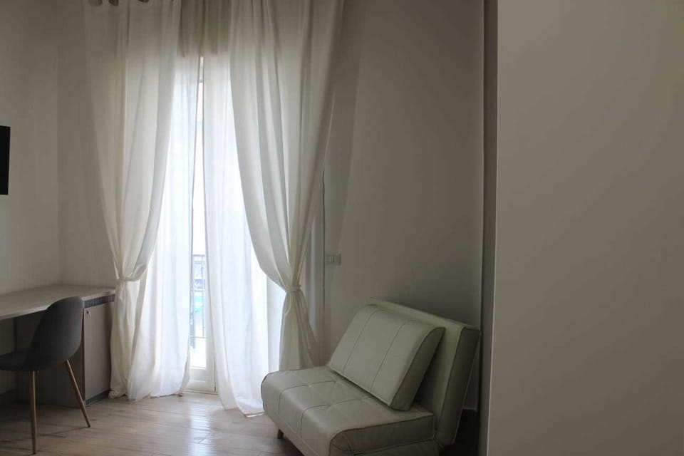 Deluxe Double Room | Living area | Flat-screen TV