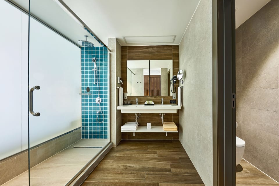 Eco-friendly toiletries, hair dryer, bathrobes, slippers