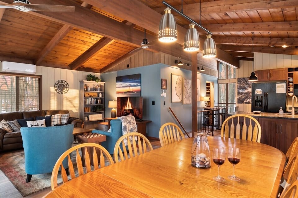 Bright dining space perfect for gathering after a day at Schuss Mountain, Torch Lake, golf courses, or Bellaire restaurants.