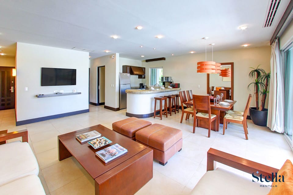 Deluxe Apartment, Kitchen, Pool View | Living area | 42-inch Smart TV with cable channels, TV