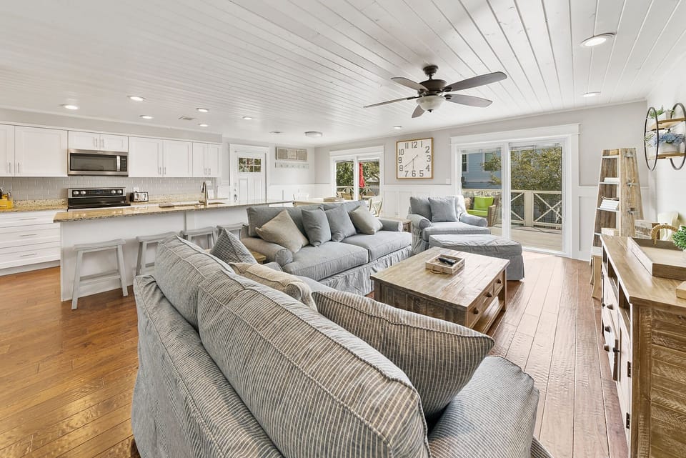 Relax in your spacious open-plan living area with plush seating and a gourmet kitchen, perfect for memorable evenings.