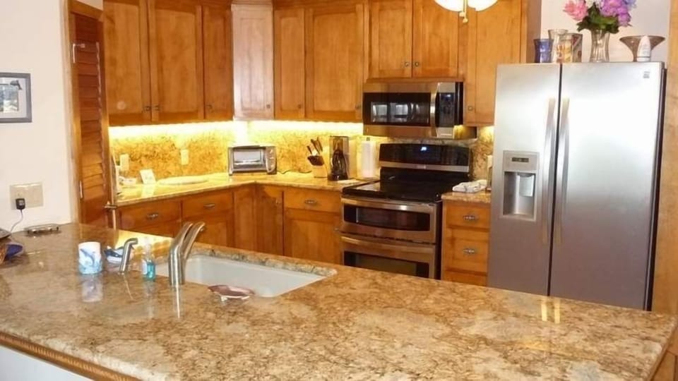 Everybody likes to gather in the kitchen. Plenty of room to cook or entertain.