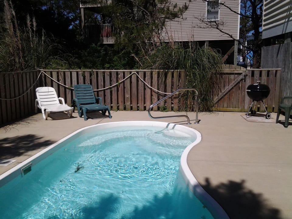 Enjoy a snack on the Poolside Charcoal BBQ