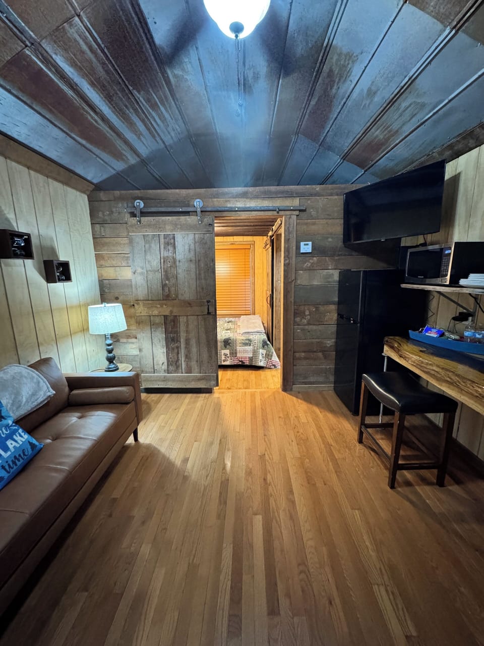 Featuring beautiful hardwood floors, old barn tin ceilings, rustic barn doors.