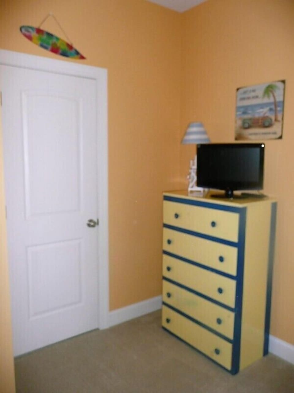 Chest and door to bathroom from the bunkbed room