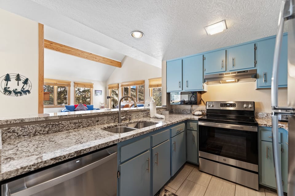 Cook memorable meals in your fully-equipped kitchen featuring granite countertops, stainless appliances, and stunning mountain views.