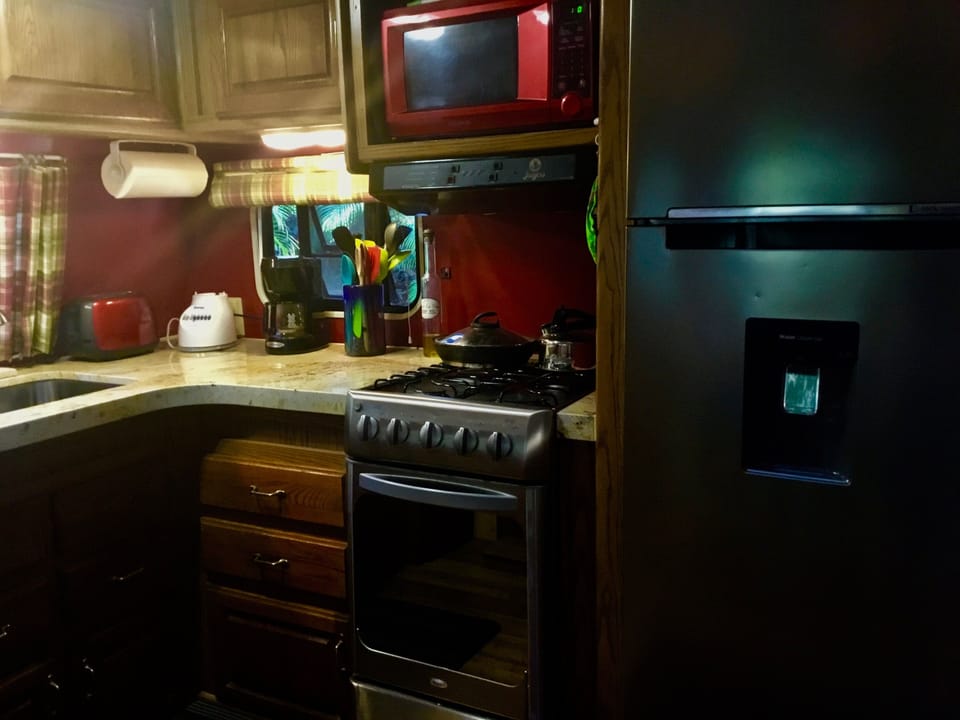 A new stove, oven and new stainless fridge finalize the kitchen remodel.