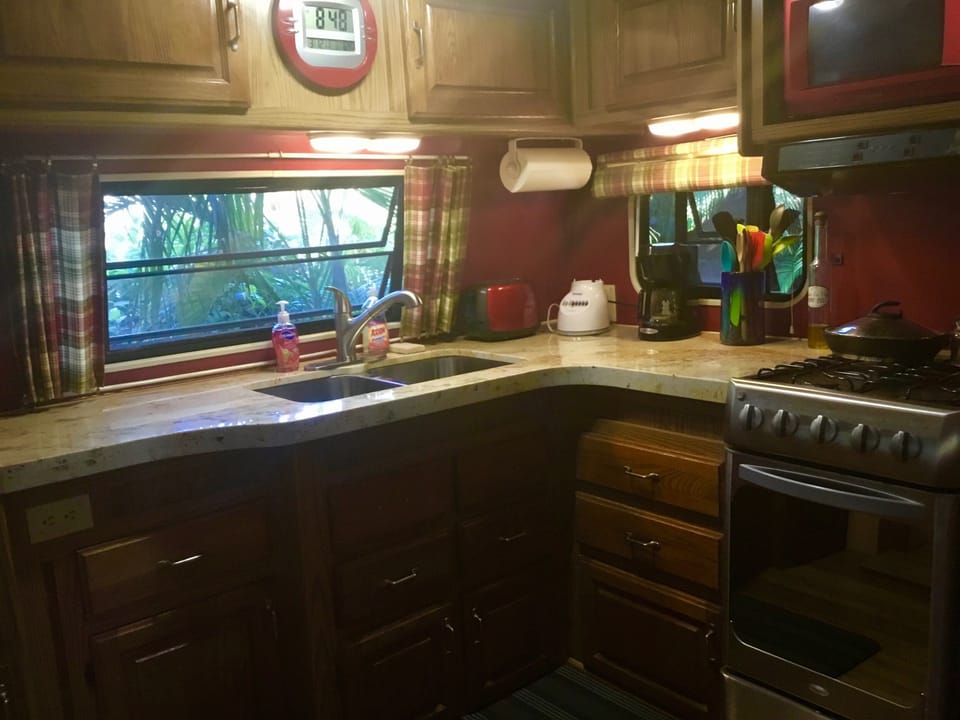 A full size sink and granite counter add to the home feeling of this casita.