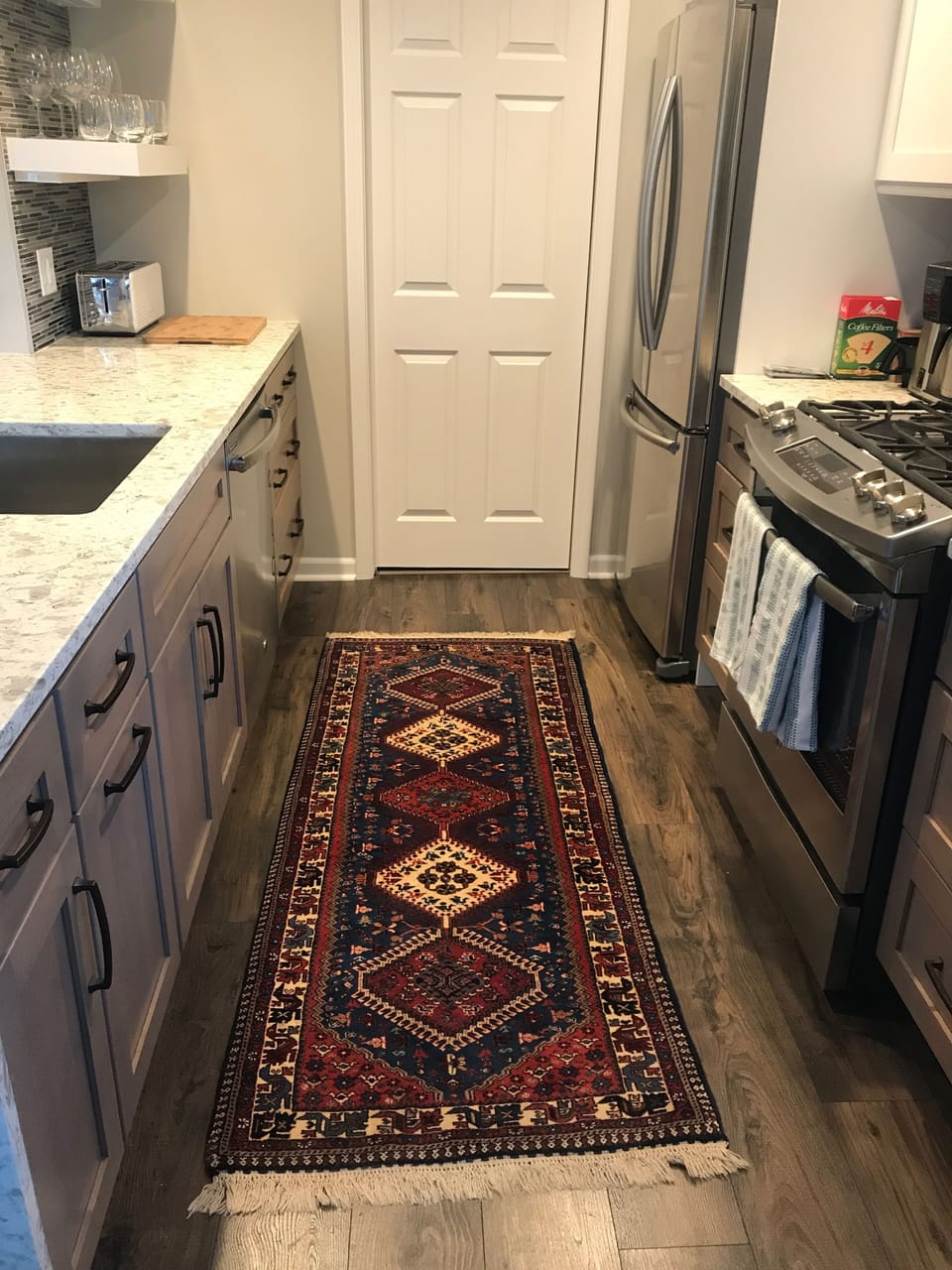 Another view of the kitchen area with  Persian runner.