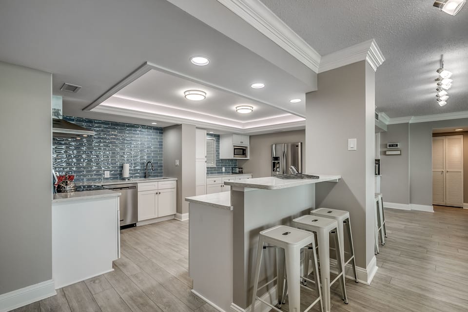 Kitchen has bar seating for 3