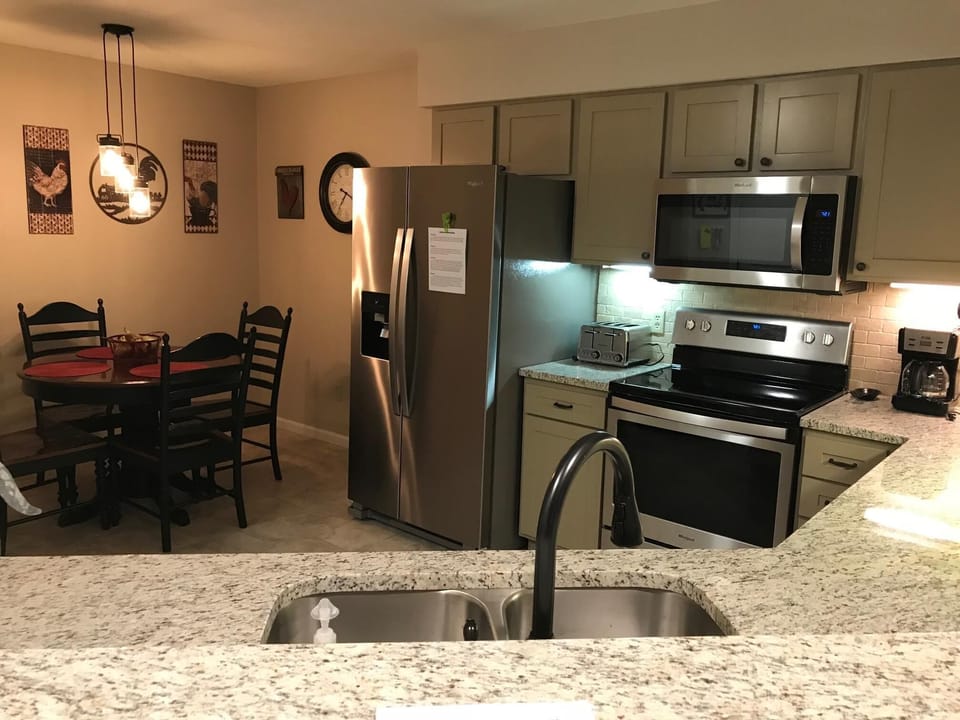 Well-stocked kitchen with breakfast nook