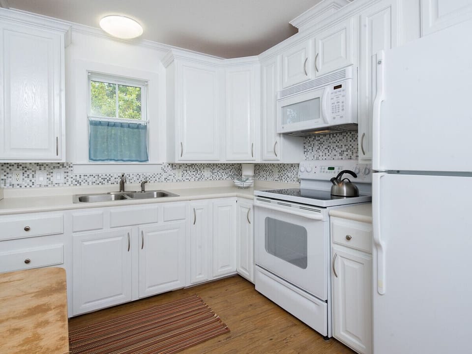 Kitchen is well stocked with dishes, cookware, coffee make and much more