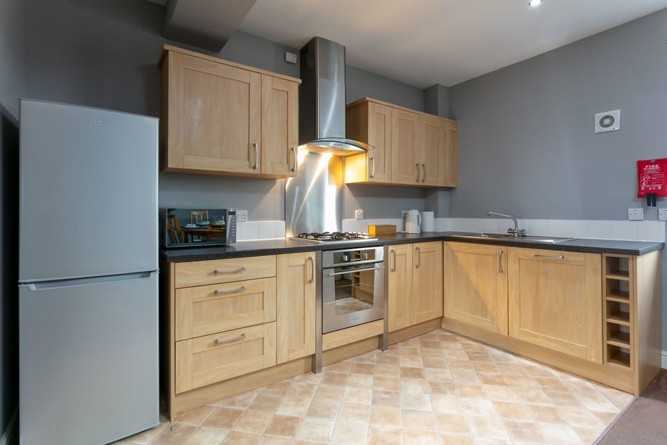 Basic Apartment, 2 Bedrooms, Non Smoking | Private kitchen | Stovetop, electric kettle, highchair, dining tables