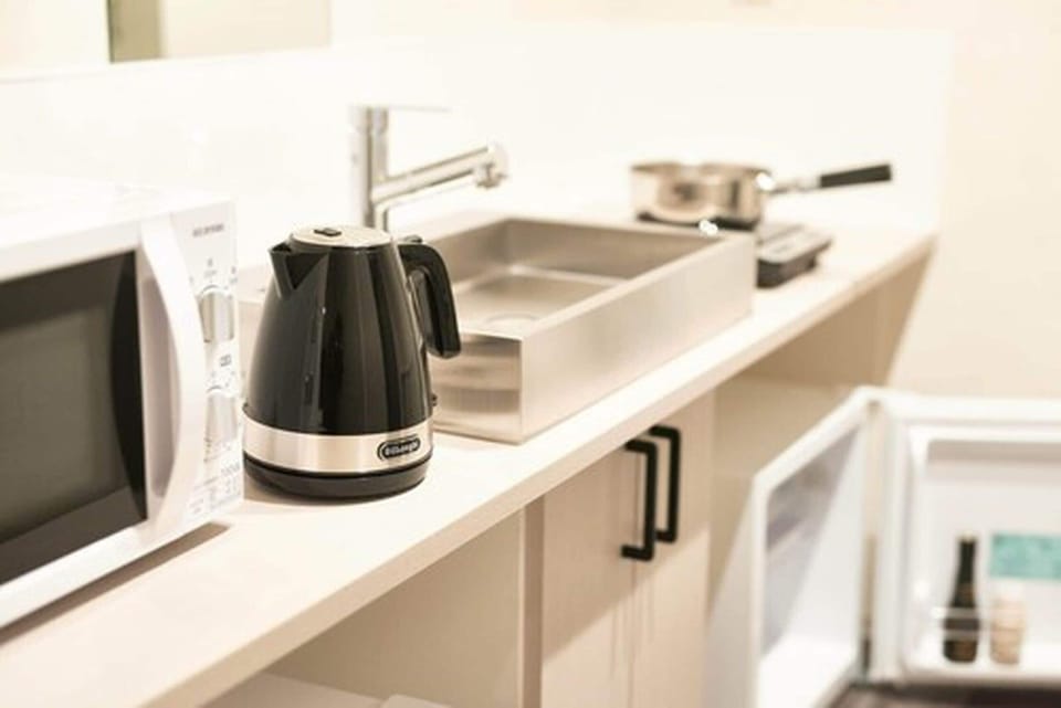 Family Room, Multiple Beds | Private kitchen | Fridge, microwave, electric kettle, cookware/dishes/utensils