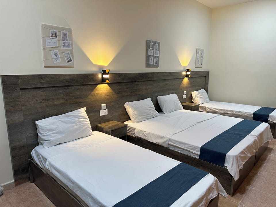 Economy Quadruple Room, 1 Bedroom, Terrace, Sea View | In-room safe, individually furnished, desk, laptop workspace