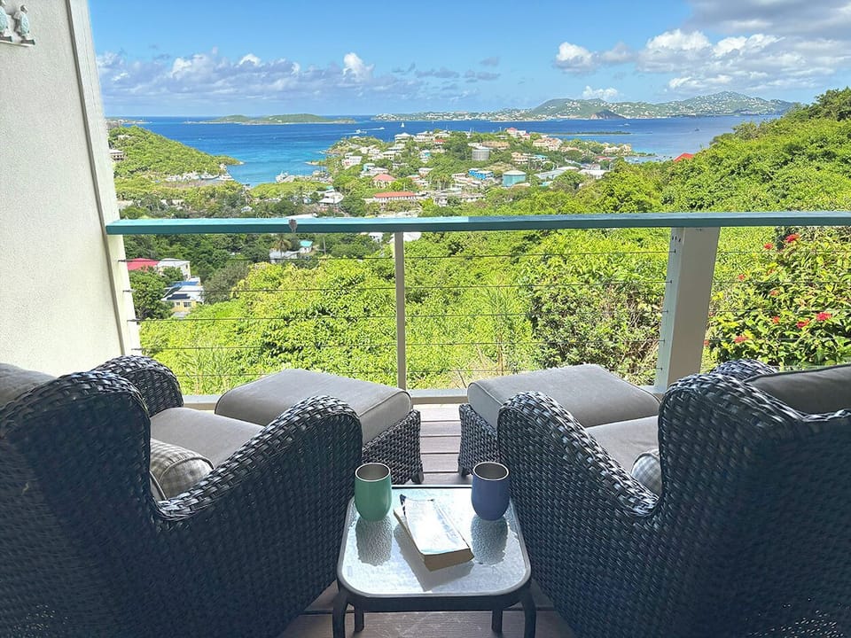 The covered balcony includes new outdoor furniture.  A perfect spot to enjoy your favorite beverage. 