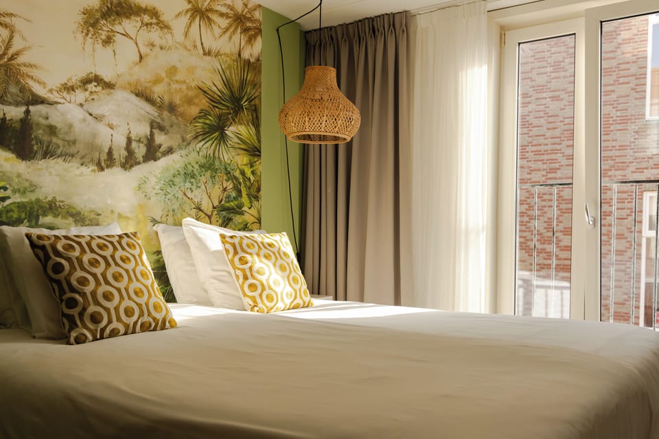 Deluxe Room | In-room safe, individually decorated, desk, blackout drapes