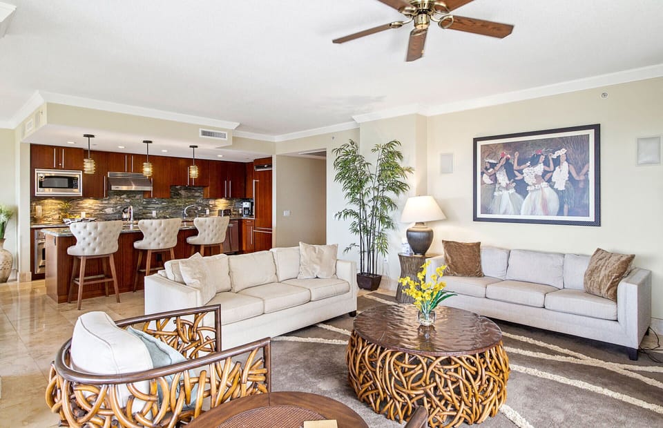 The living room offers a queen convertible sofa sleeper
                