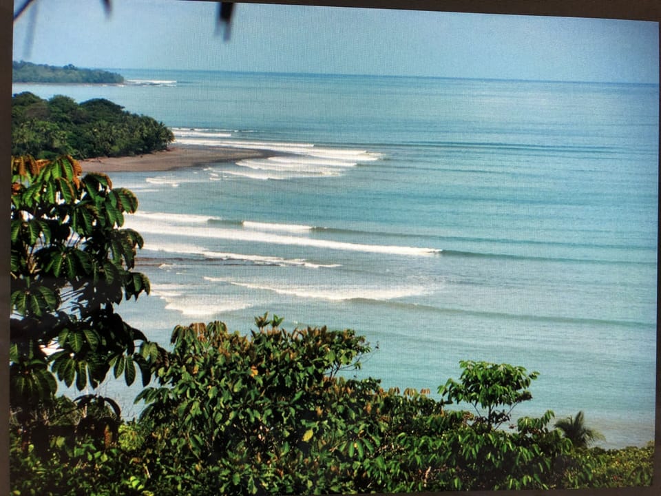 The break at punta Pilon in the foreground and Pavones in the distance