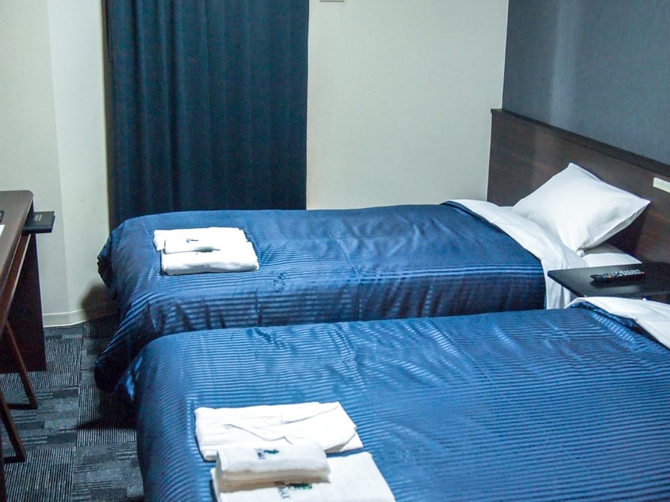 Desk, laptop workspace, free WiFi, bed sheets