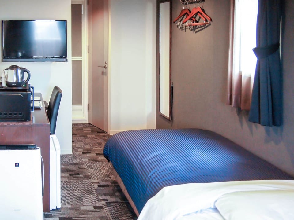 Desk, laptop workspace, free WiFi, bed sheets