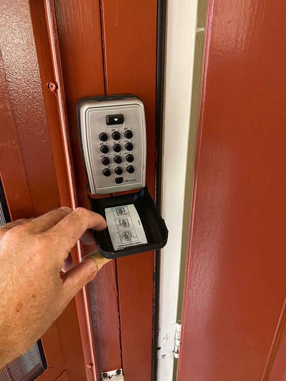 Key lock box mounted on door jamb