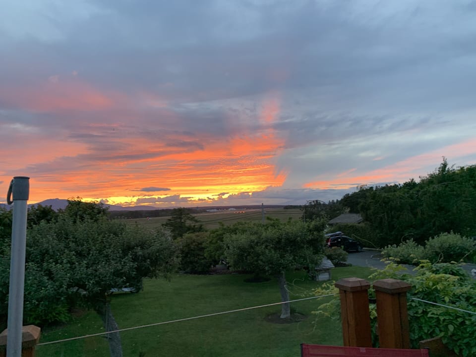 West facing sunset deck off the master bedroom; ocean, yard and garden views. 