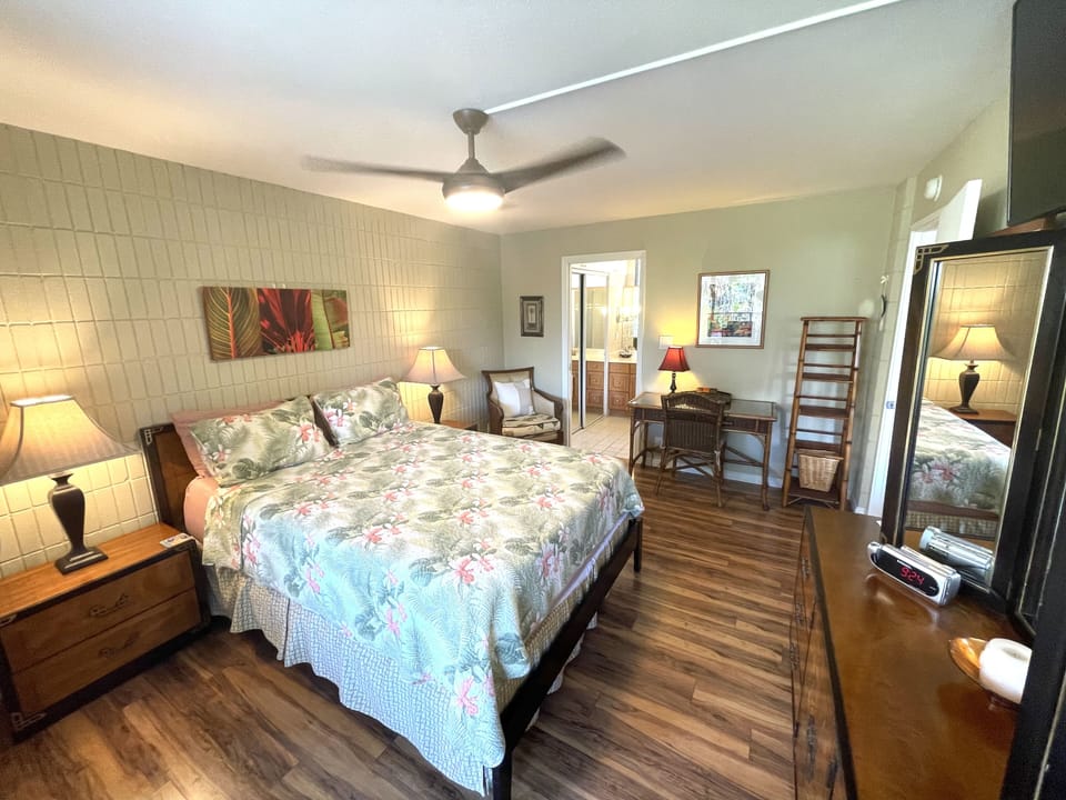 Master Bedroom has Tommy Bahama blanket and pillow covers. 