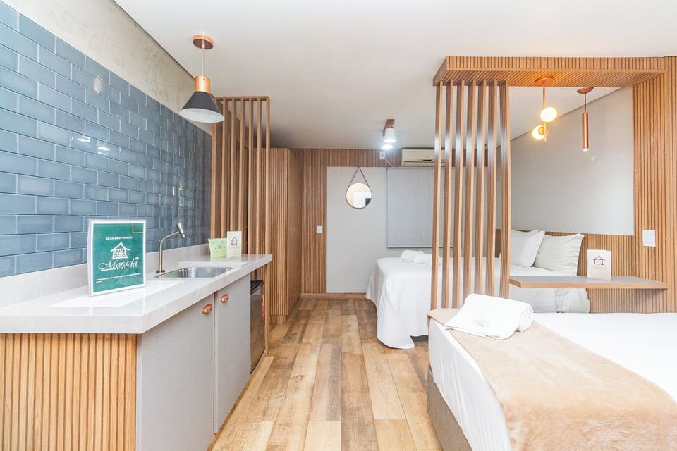 Deluxe Quadruple Room | Minibar, blackout drapes, free WiFi, bed sheets