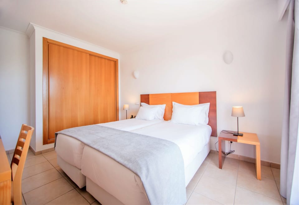 Superior Apartment, 1 Bedroom, Pool View | 1 bedroom, desk, blackout drapes, iron/ironing board