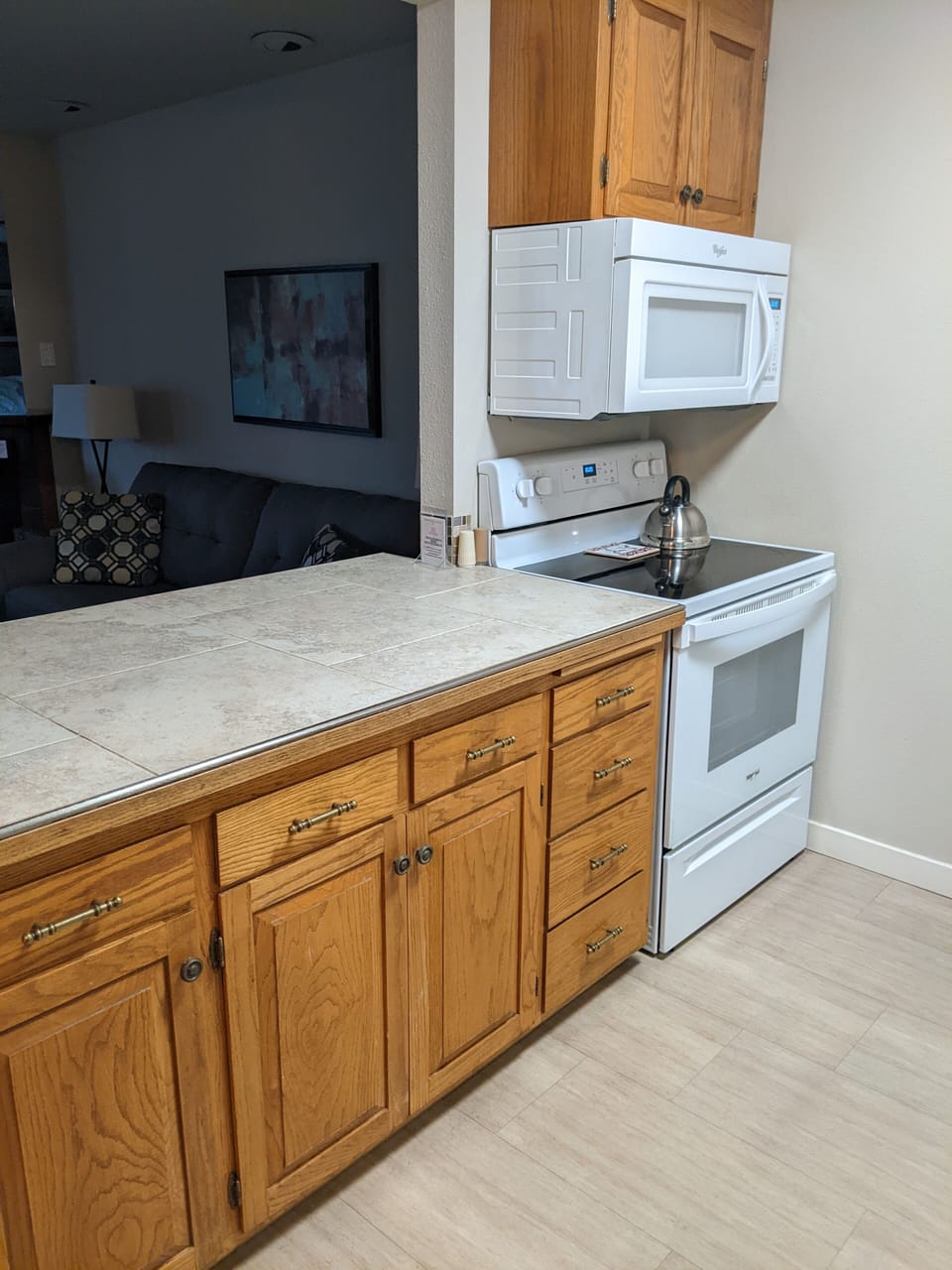 Water View Condo | Private kitchen | Full-size fridge, microwave, oven, stovetop
