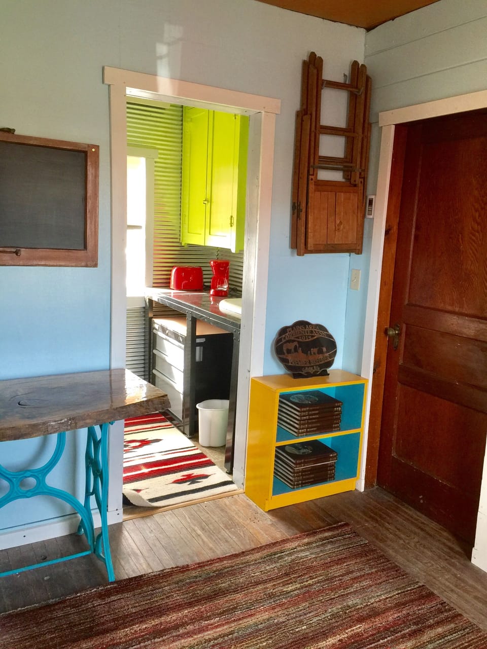 Looking into the cabin's kitchen from the living room. 