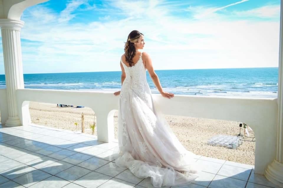 Bride on upper Deck of Master. Bride's maids getting ready inside with wet bar!