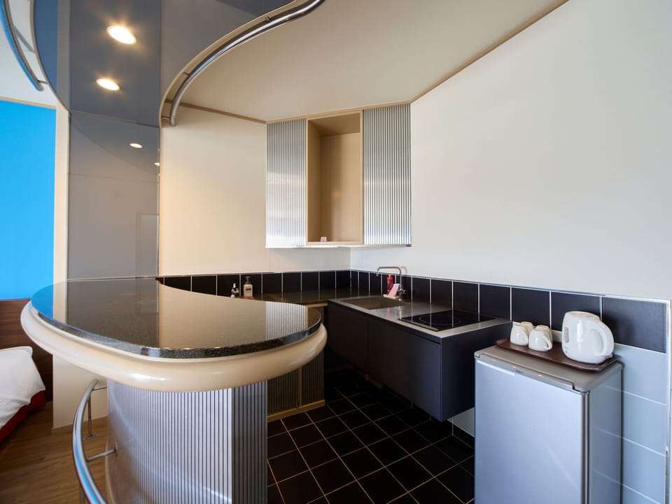 Deluxe Room, Non Smoking | Desk, laptop workspace, soundproofing, iron/ironing board (on request)
