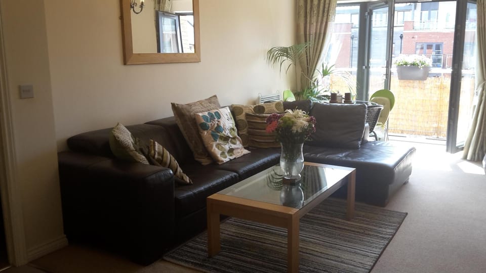 lounge dining area with sideboard/tv,coffee table and dining table and chai