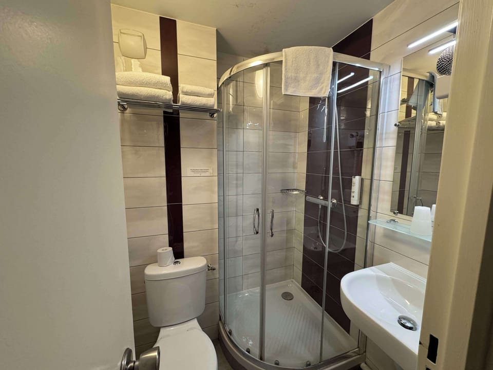 Shower, free toiletries, hair dryer, towels
