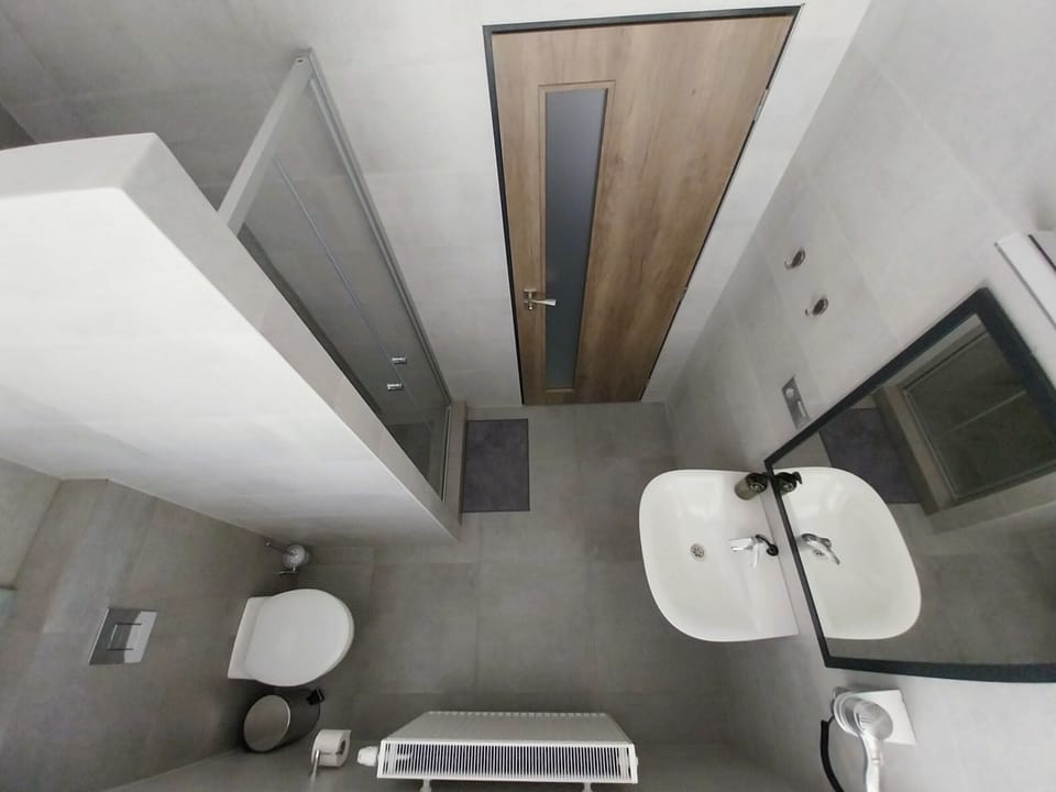 Shower, hair dryer, towels, toilet paper