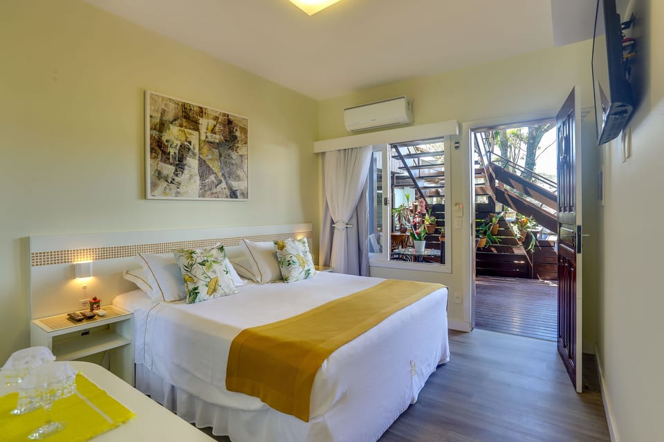 Apartamento Standard | Minibar, in-room safe, blackout drapes, free WiFi