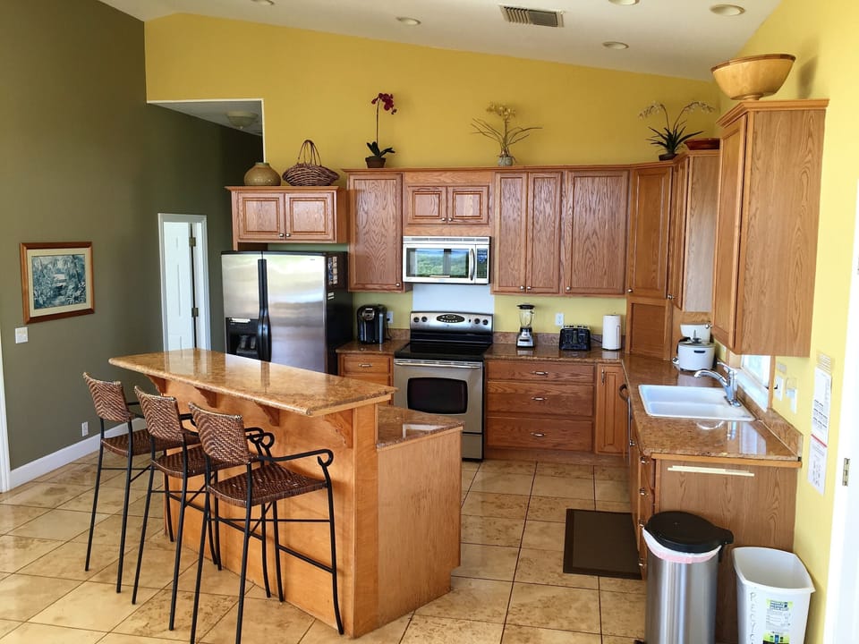 Kitchen with Stainless Steel appliances and Granite Countertops.  Ocean Views